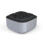 Portable air purifier and smoke removal ashtray on table.