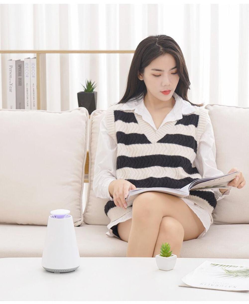 Portable mosquito killer lamp and bug zapper on table.
